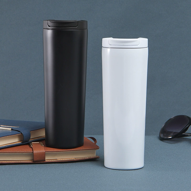 Black and white straight body coffee cups with closed lids on a dark background.